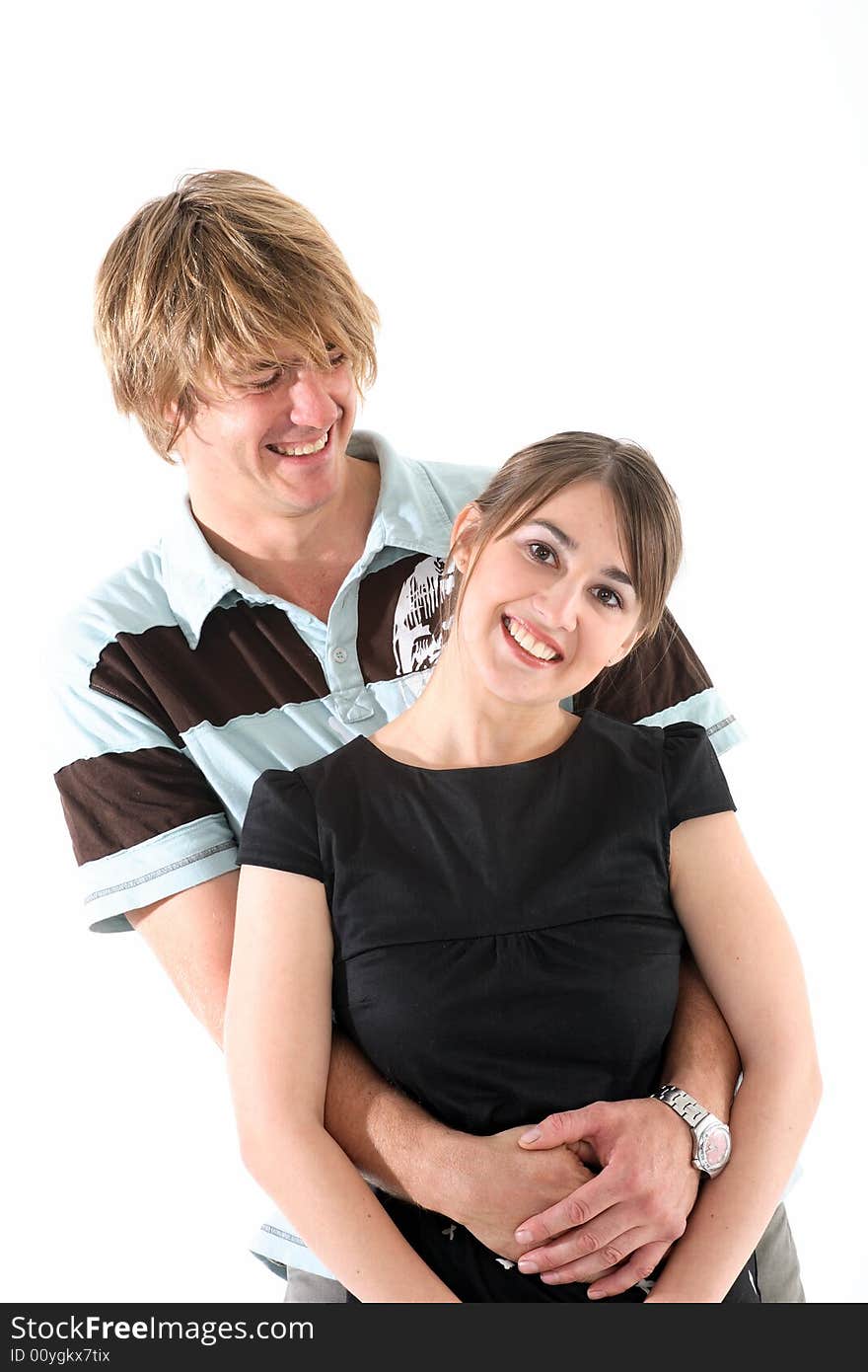 A portrait of a couple in love isolated on white. A portrait of a couple in love isolated on white