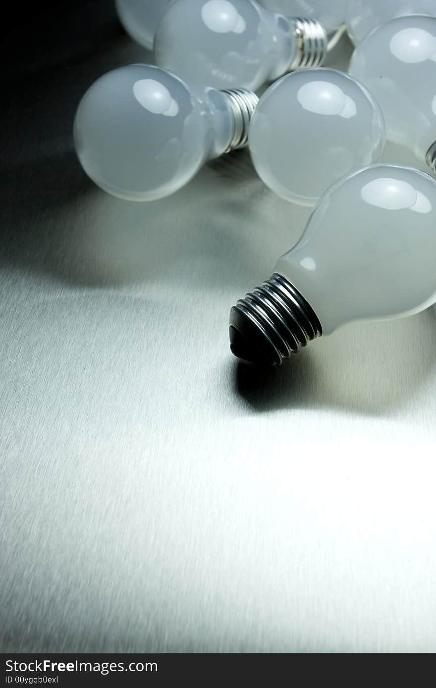 Series of lightbulbs on metal desk