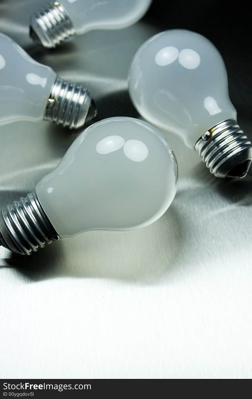 Series of lightbulbs on metal desk