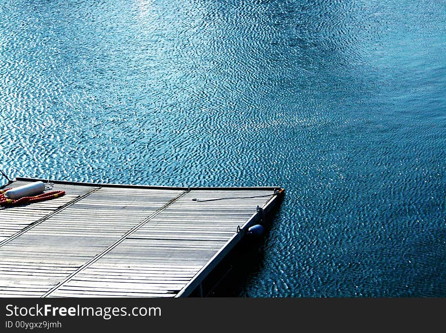 Wooden pier and blue waters