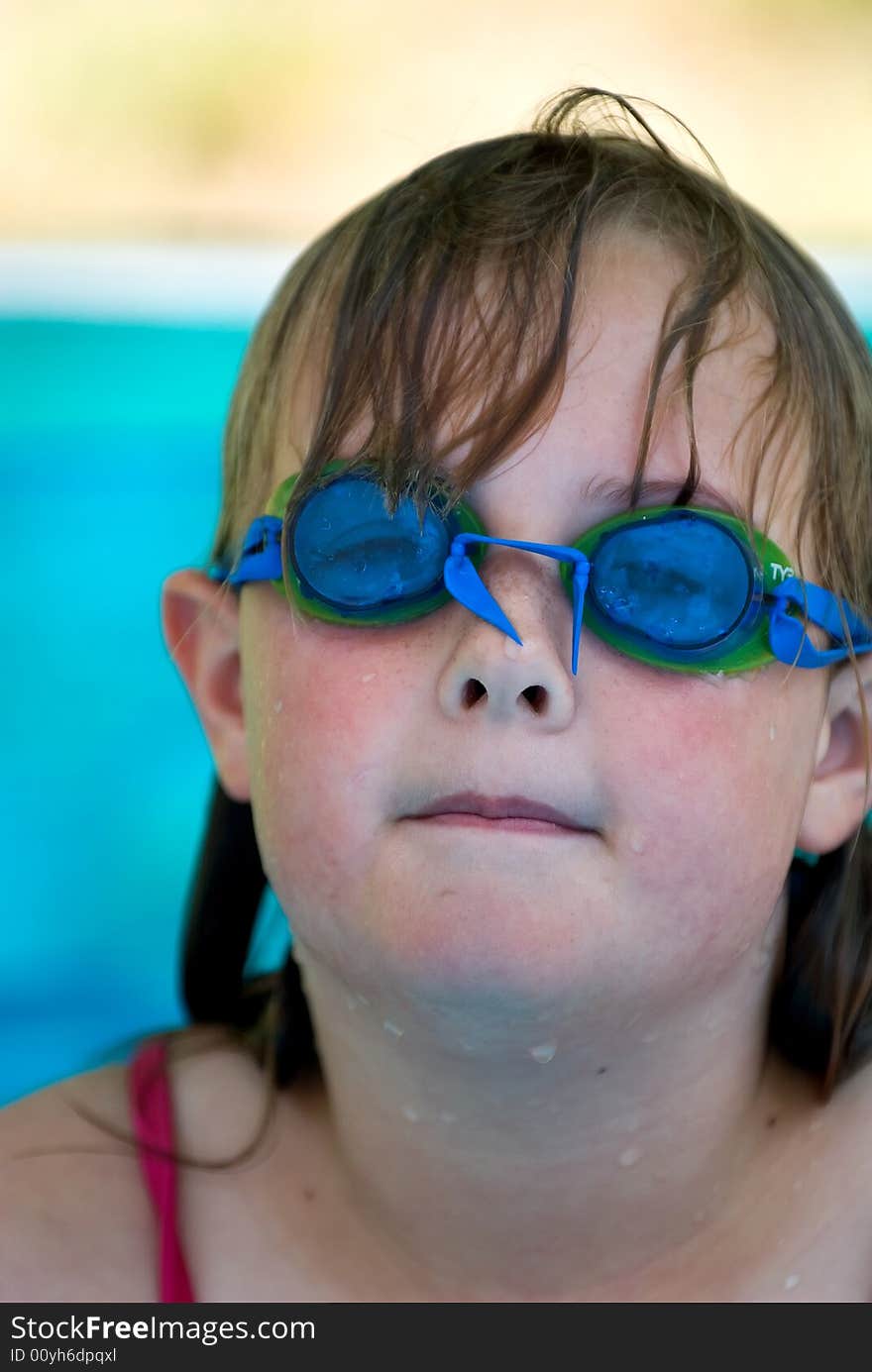 Young girl with swimming goggles