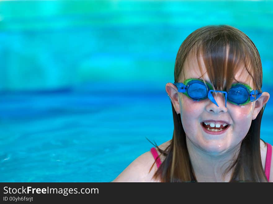 Young girl with swimming goggles