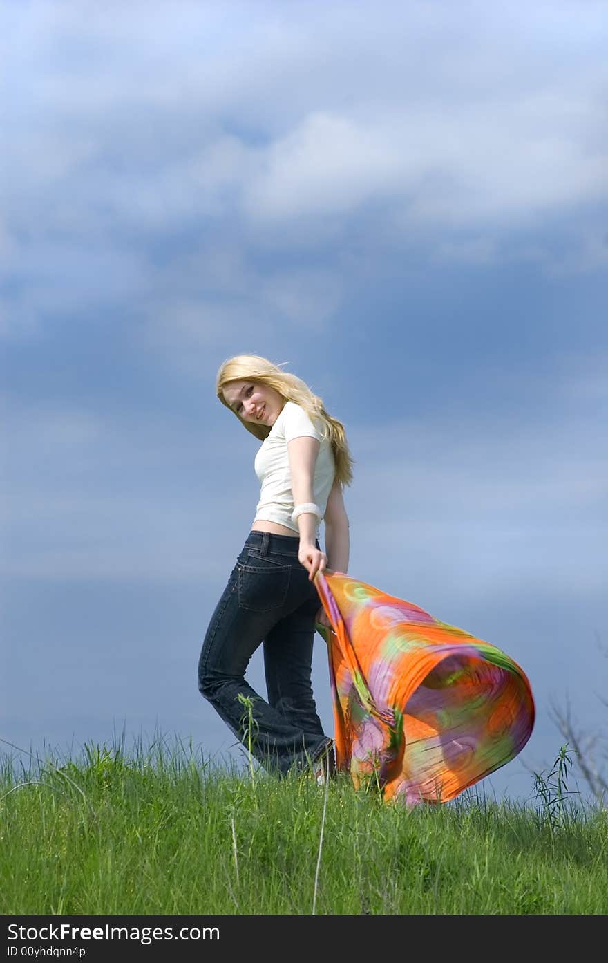 Girl with  scarf stand on a wind. Girl with  scarf stand on a wind