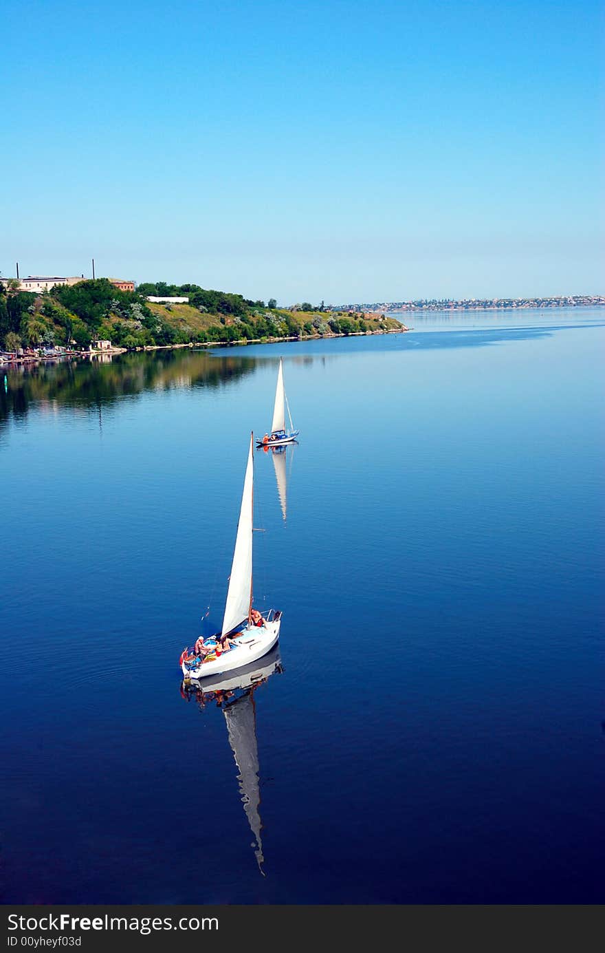 Calm river scenic with yachts. bird fly view