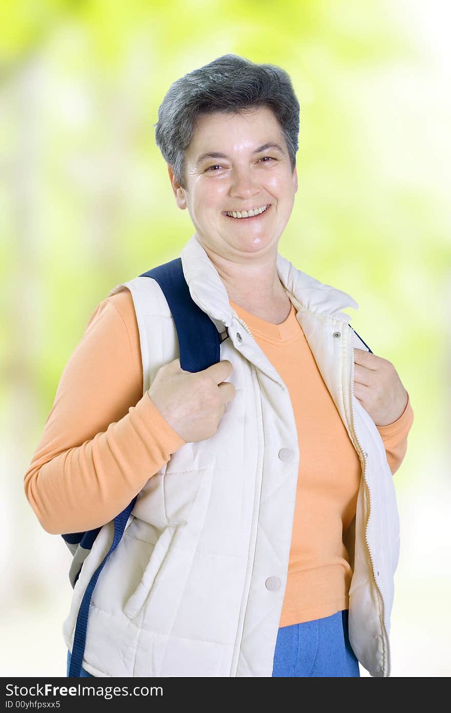 Senior woman on walk in countryside