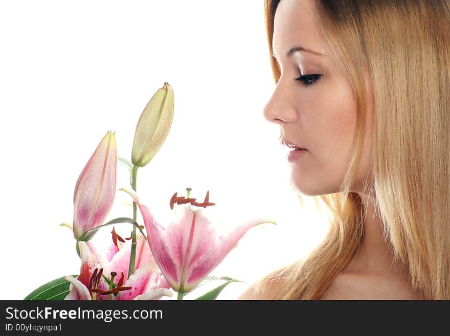 Beauty portrait of a young woman isolated on white background with a flower. Beauty portrait of a young woman isolated on white background with a flower