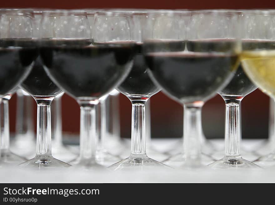 A part with black and white glasses of wine. A part with black and white glasses of wine