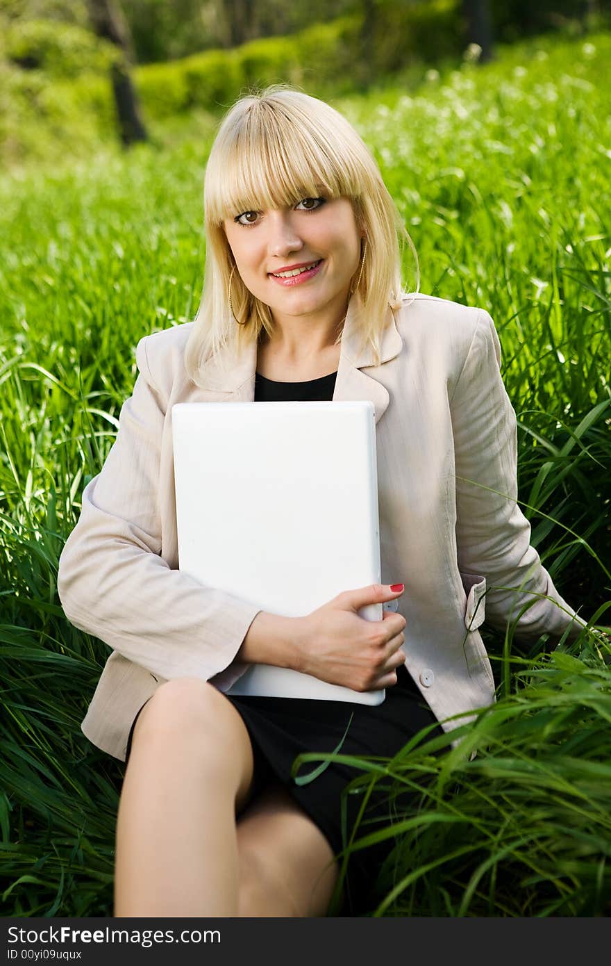 A young businesswoman with laptop. A young businesswoman with laptop