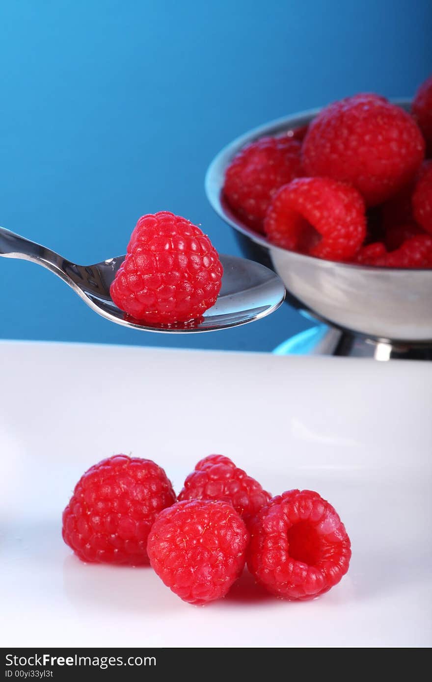 Plate and bowl of fresh raspberry. Plate and bowl of fresh raspberry