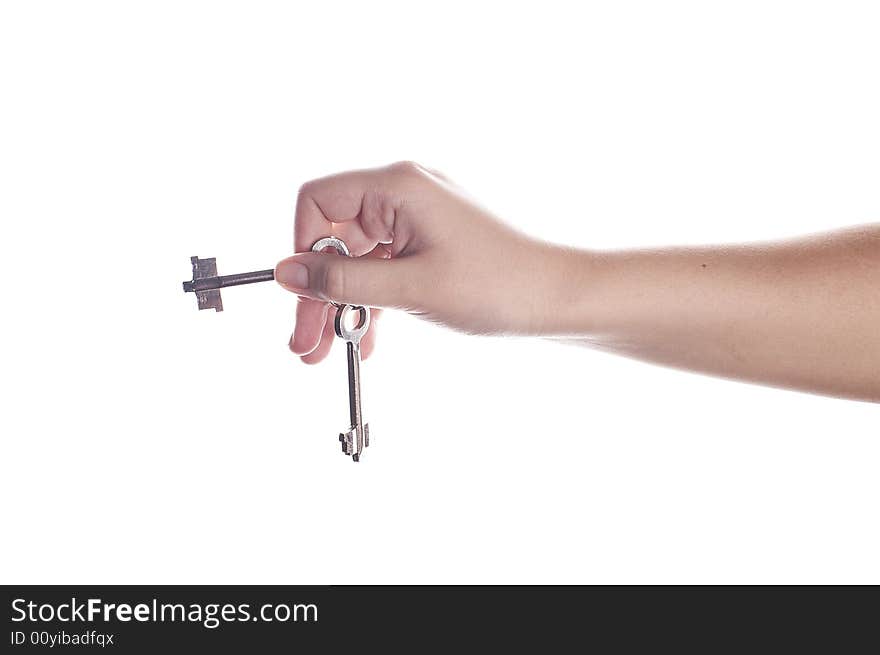 Old keys in hand isolated on white.