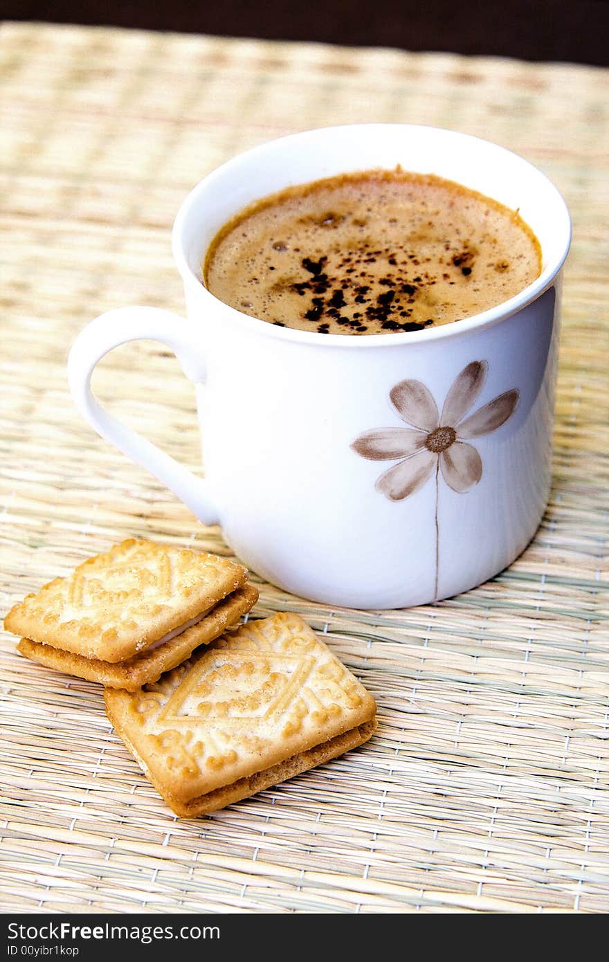 Cup of hot coffee with two biscuits. Cup of hot coffee with two biscuits