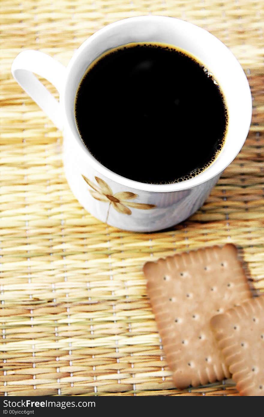 Cup of hot coffee with two biscuits. Cup of hot coffee with two biscuits