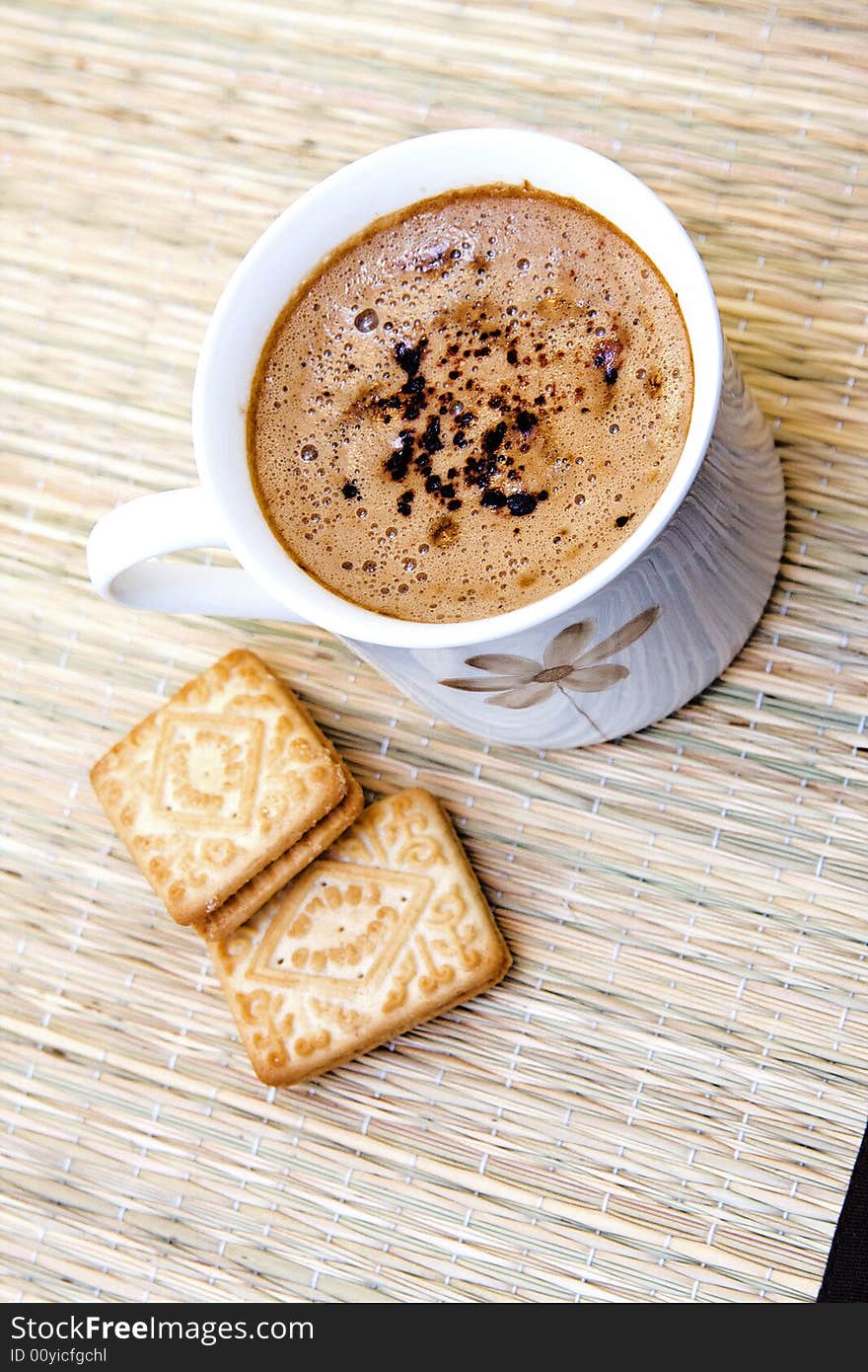 Cup of hot coffee with two biscuits. Cup of hot coffee with two biscuits