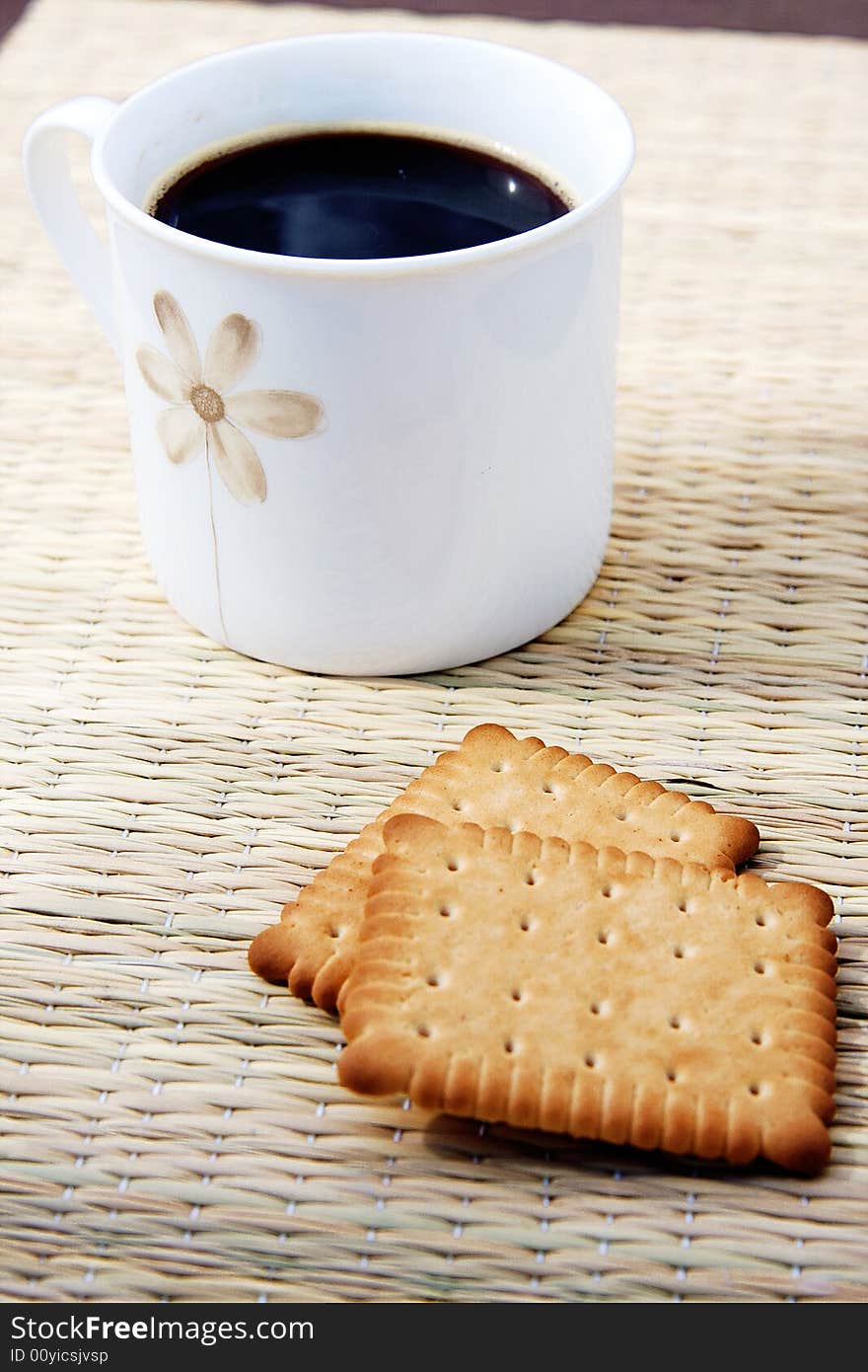 Cup of hot coffee with two biscuits. Cup of hot coffee with two biscuits