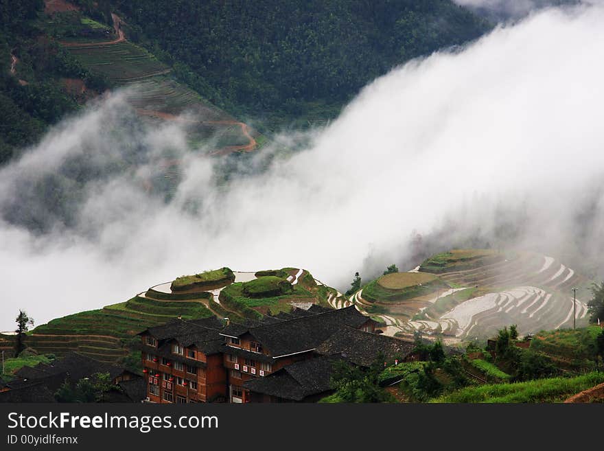 This Zhuang ethnic minority village is located high in the Longji mountains. These rice terraces were constructed by the Zhuang minority people to make their mountainous land arable. With construction beginning in the Yuan dynasty (1271-1368) and lasting over 400 years, the Dragon's Backbone rice terraces now cover over 16,000 acres.