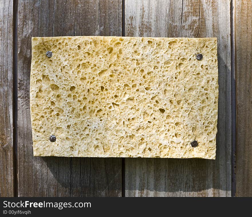 Old Sponge On Wooden Background