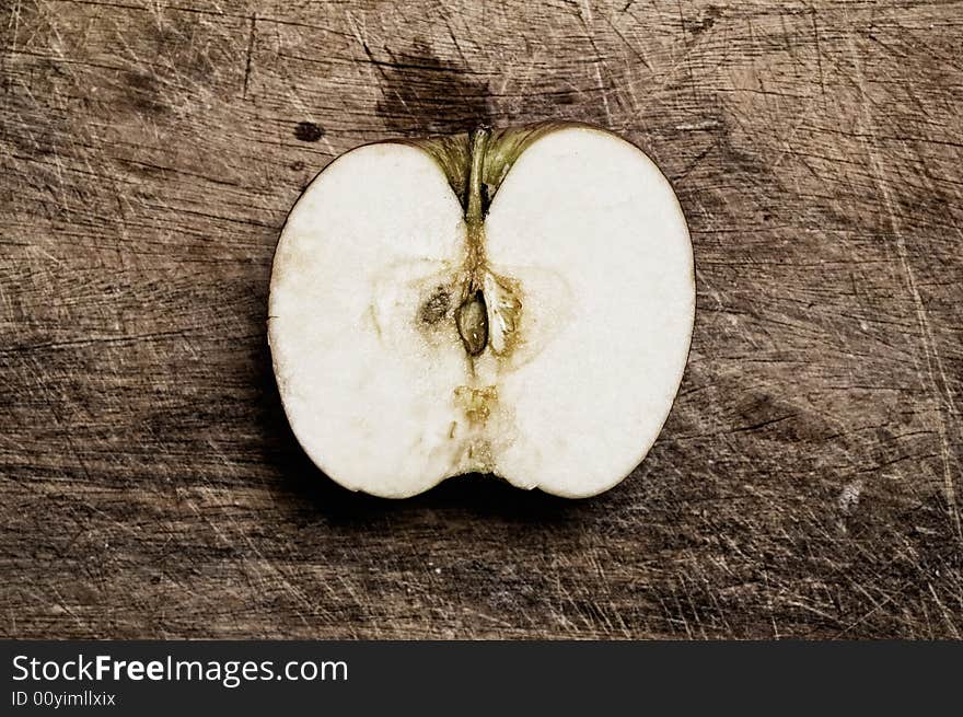 Half Apple On Table.