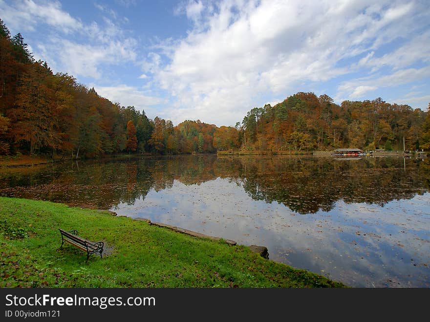 A bench near lake taken in fall.