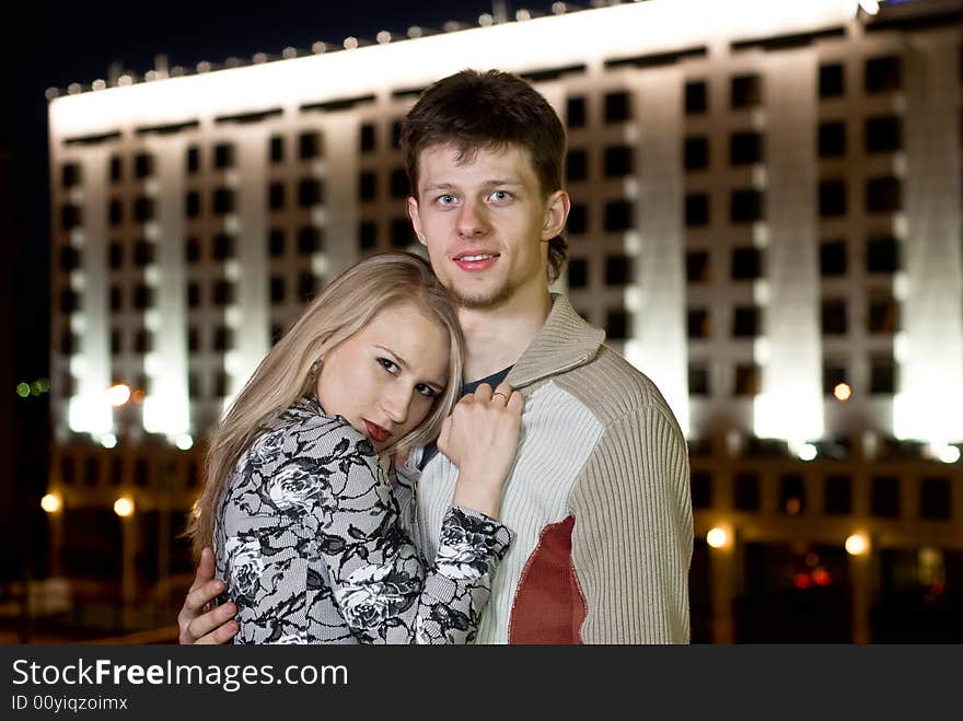 Couple Against Night Building