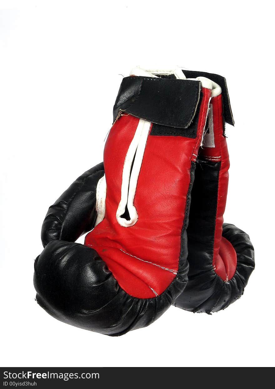 Two boxing gloves that are red and black. Two boxing gloves that are red and black