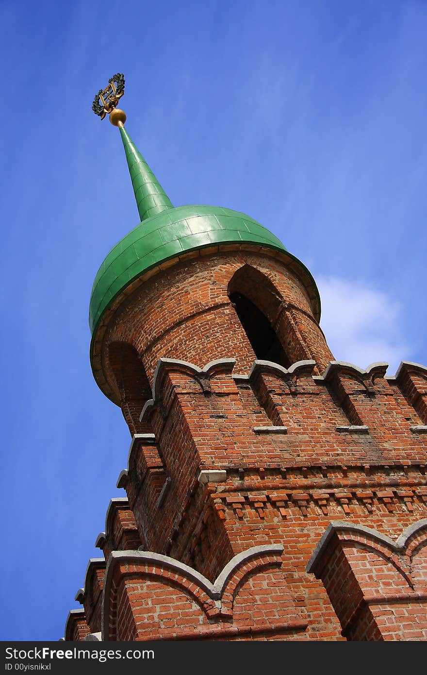 Medieval tower with loopholes a spike and the arms