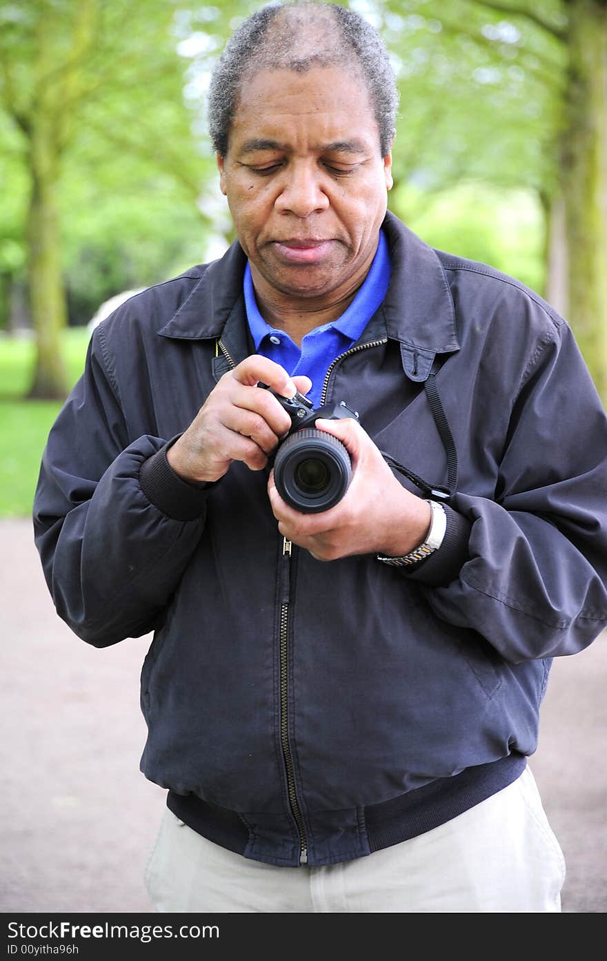 African american male photographer on assignment.