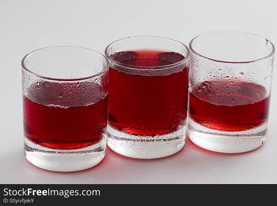 Glass glasses with a red drink. Glass glasses with a red drink