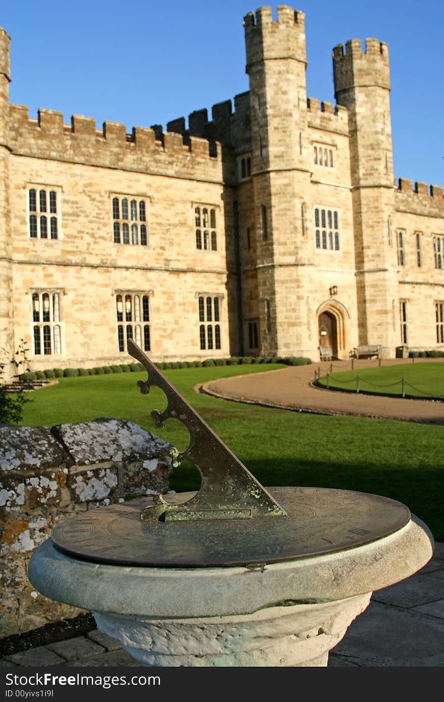 Old sundial with castle background