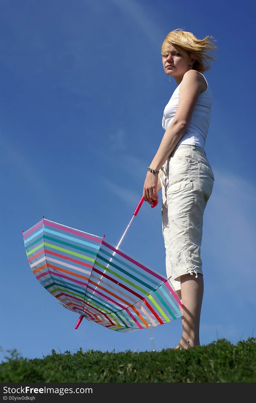 Young Charming Girl With Umbrella