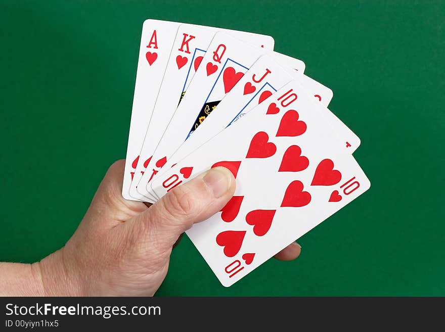 Playing cards on green background. Shot in studio. Playing cards on green background. Shot in studio.