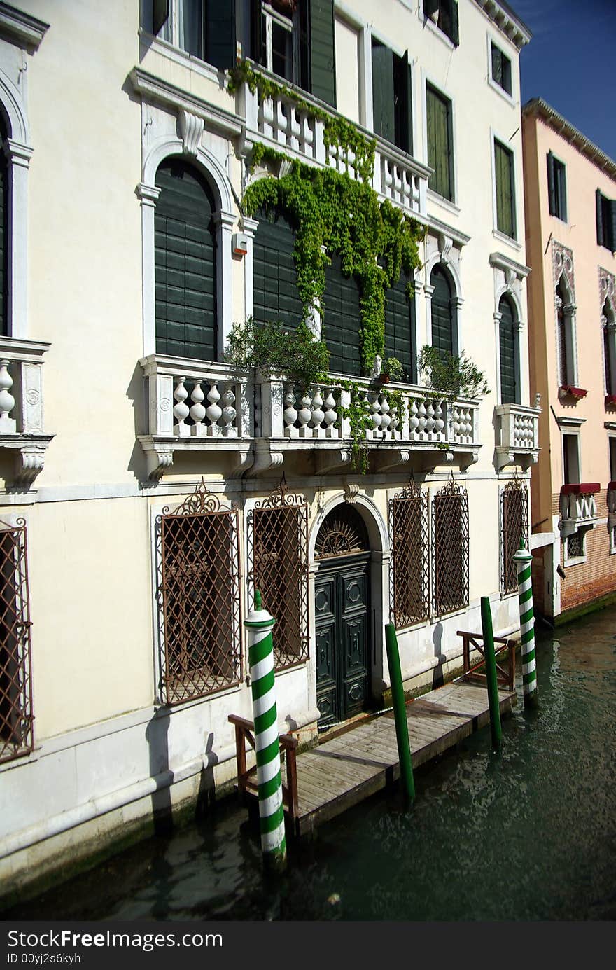 Vintage white building in Venice near canal