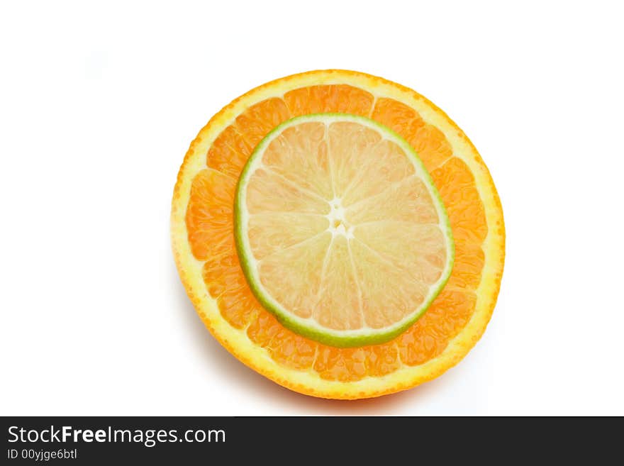 Thin Slice of lime on a slice of orange isolated on white. Thin Slice of lime on a slice of orange isolated on white.