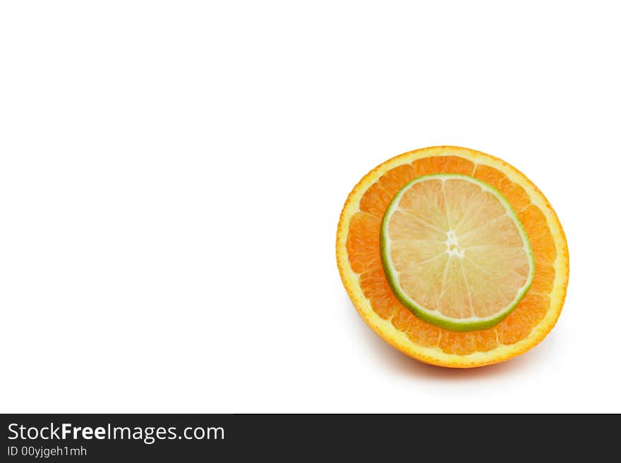 Thin Slice of lime on a slice of orange isolated on white. Thin Slice of lime on a slice of orange isolated on white.