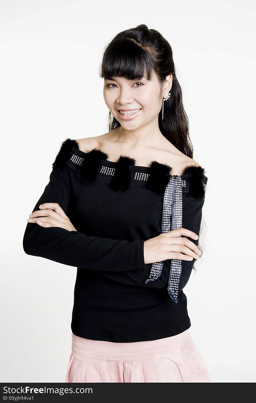 Asian woman smiling at camera, against white background