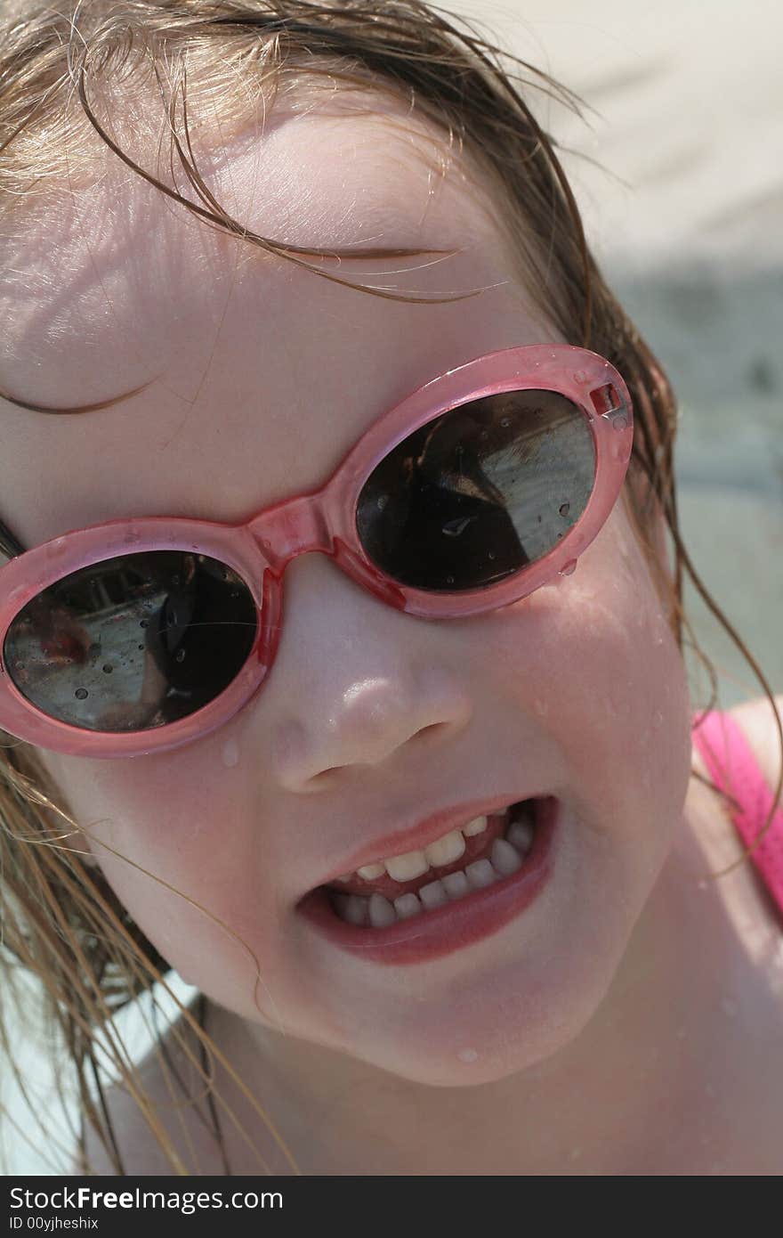 A four year old girl enjoying the pool. A four year old girl enjoying the pool