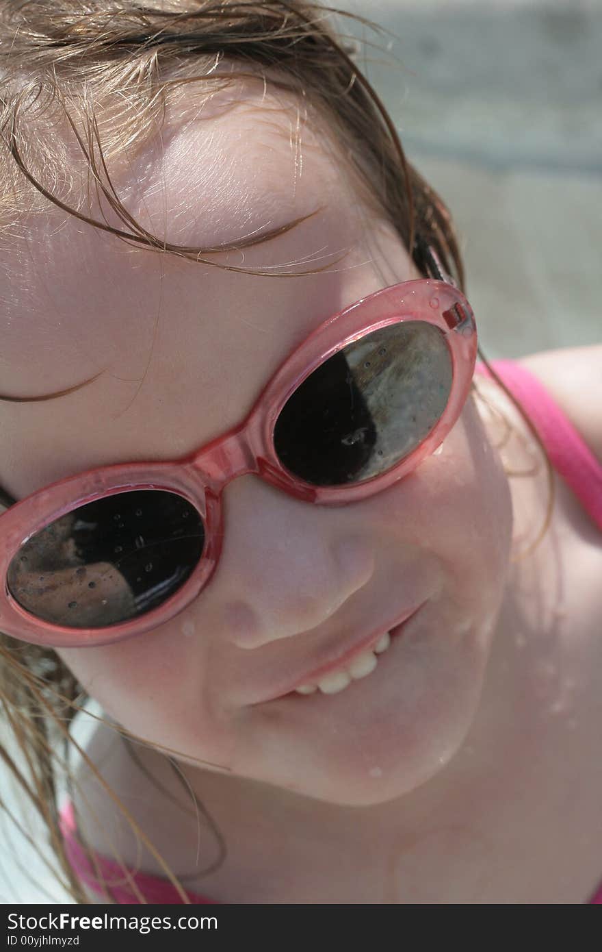 A four year old girl enjoying the pool. A four year old girl enjoying the pool