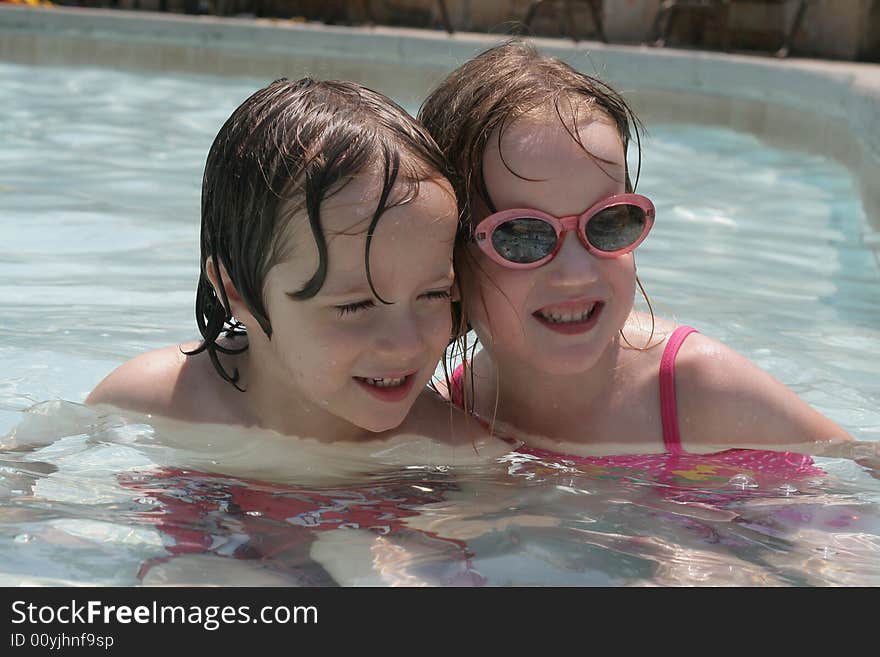 Siblings playing in the pool. Siblings playing in the pool