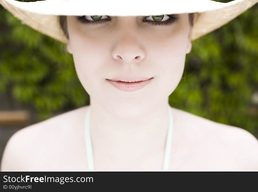 Eyes Under The Hat. Model Woman Relaxing Outdoors.