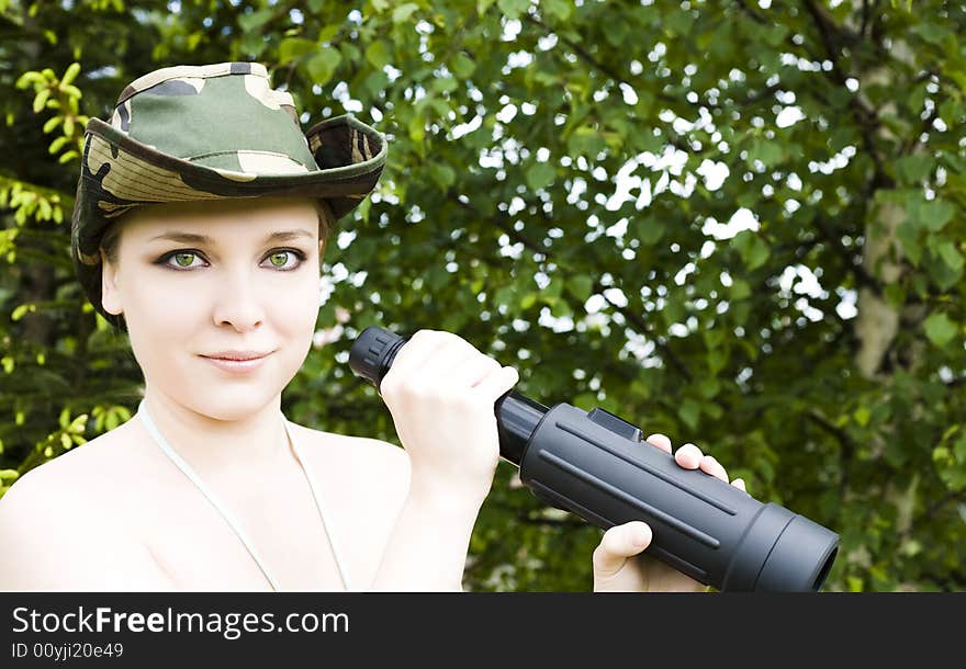 Woman With Binocular In The Forest