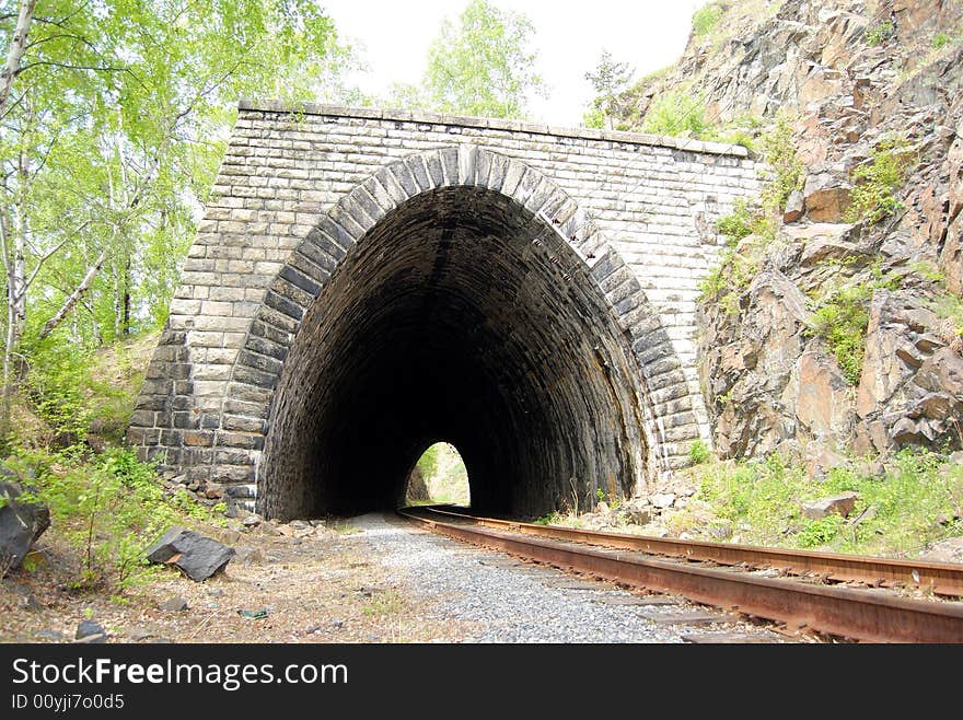 Abandoned stone tunnel over the old railroad around Bailal lake