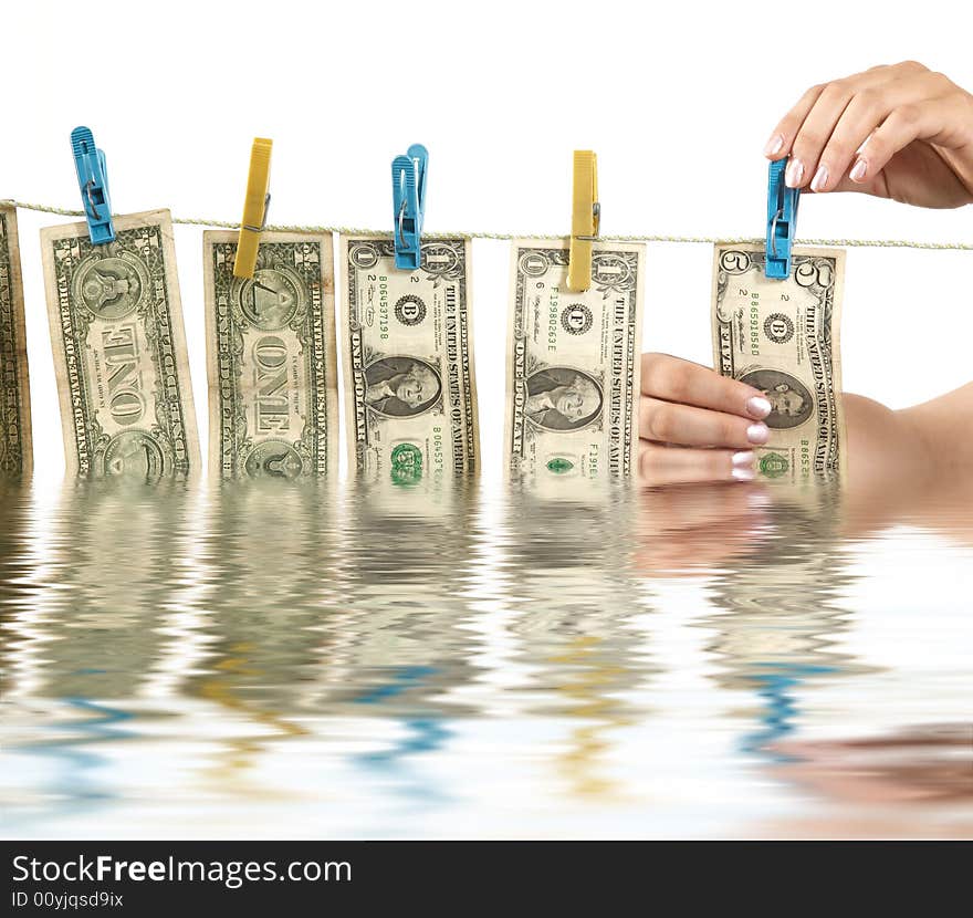 An image of hands and dollars on clothesline