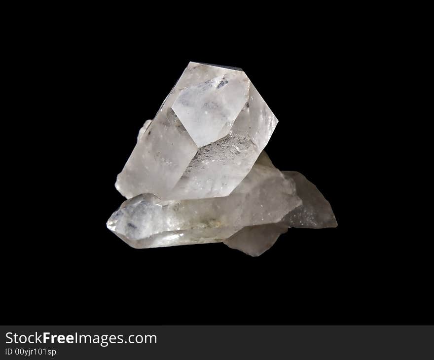 Peace of quartz isolated on black background.