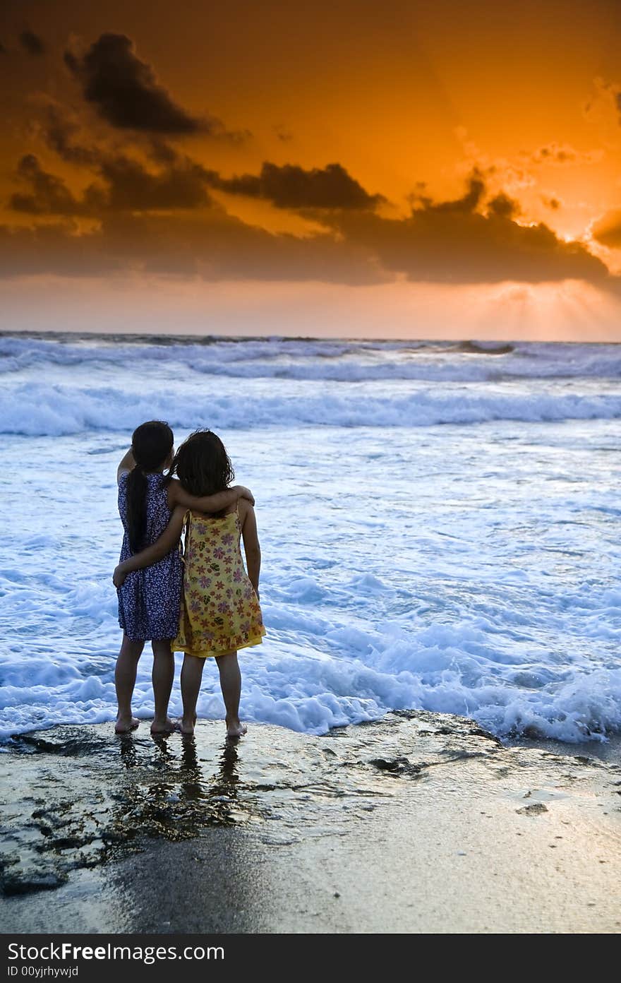 Two girls in the beach at sunset. Two girls in the beach at sunset