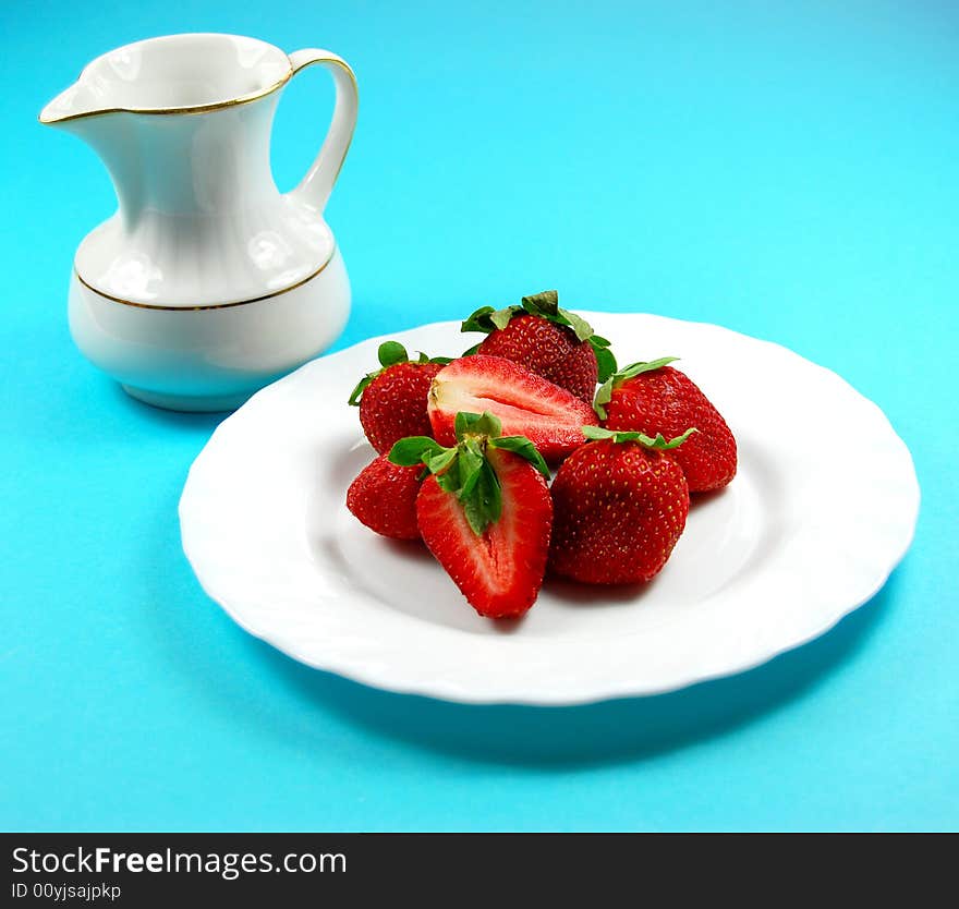 Fresh strawberry on white plait and blue background