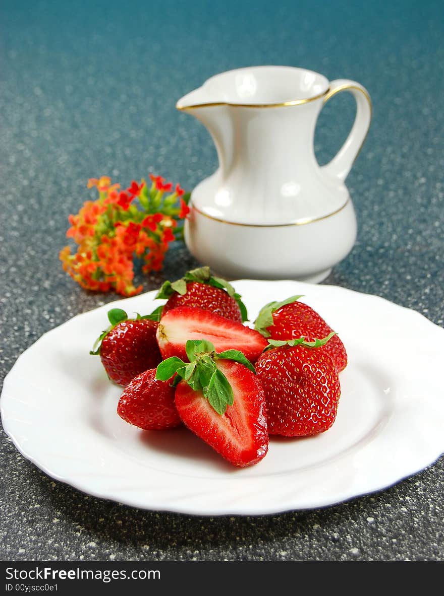 Fresh strawberry on white plait and blue background