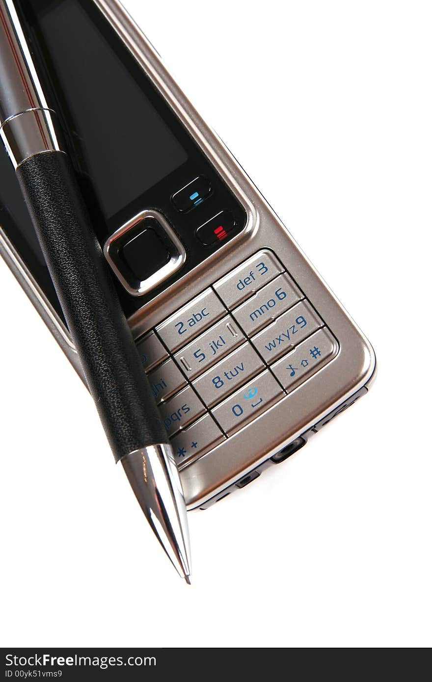 Silver mobile phone and pen close-up on white background