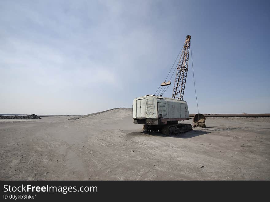 Old thrown dredge,  mining industry. Old thrown dredge,  mining industry