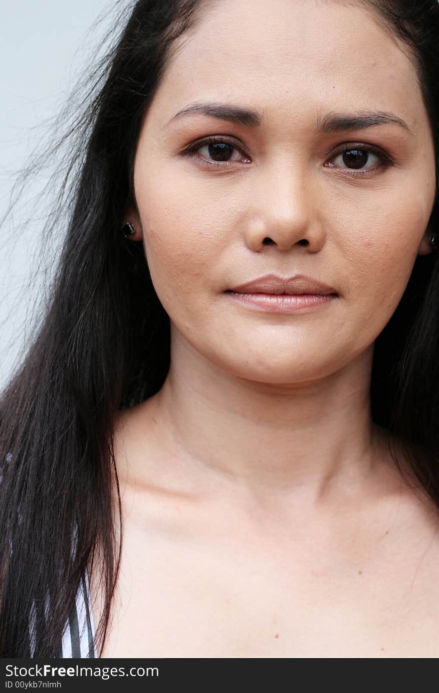 Close-up portrait of a beautiful Thai woman. Close-up portrait of a beautiful Thai woman.