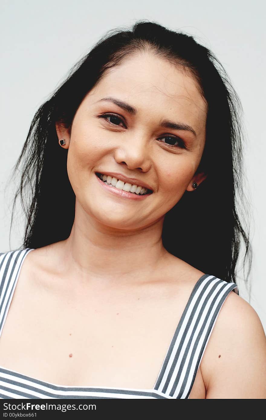 Close-up portrait of a beautiful Thai woman. Close-up portrait of a beautiful Thai woman.