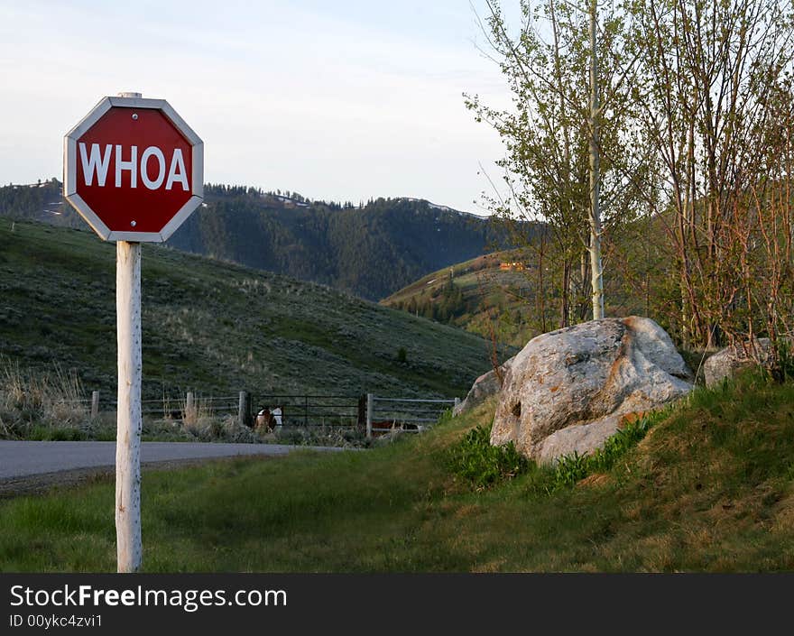 Western version of a stop sign.  Whoa is a command given to horses to stop. Western version of a stop sign.  Whoa is a command given to horses to stop.